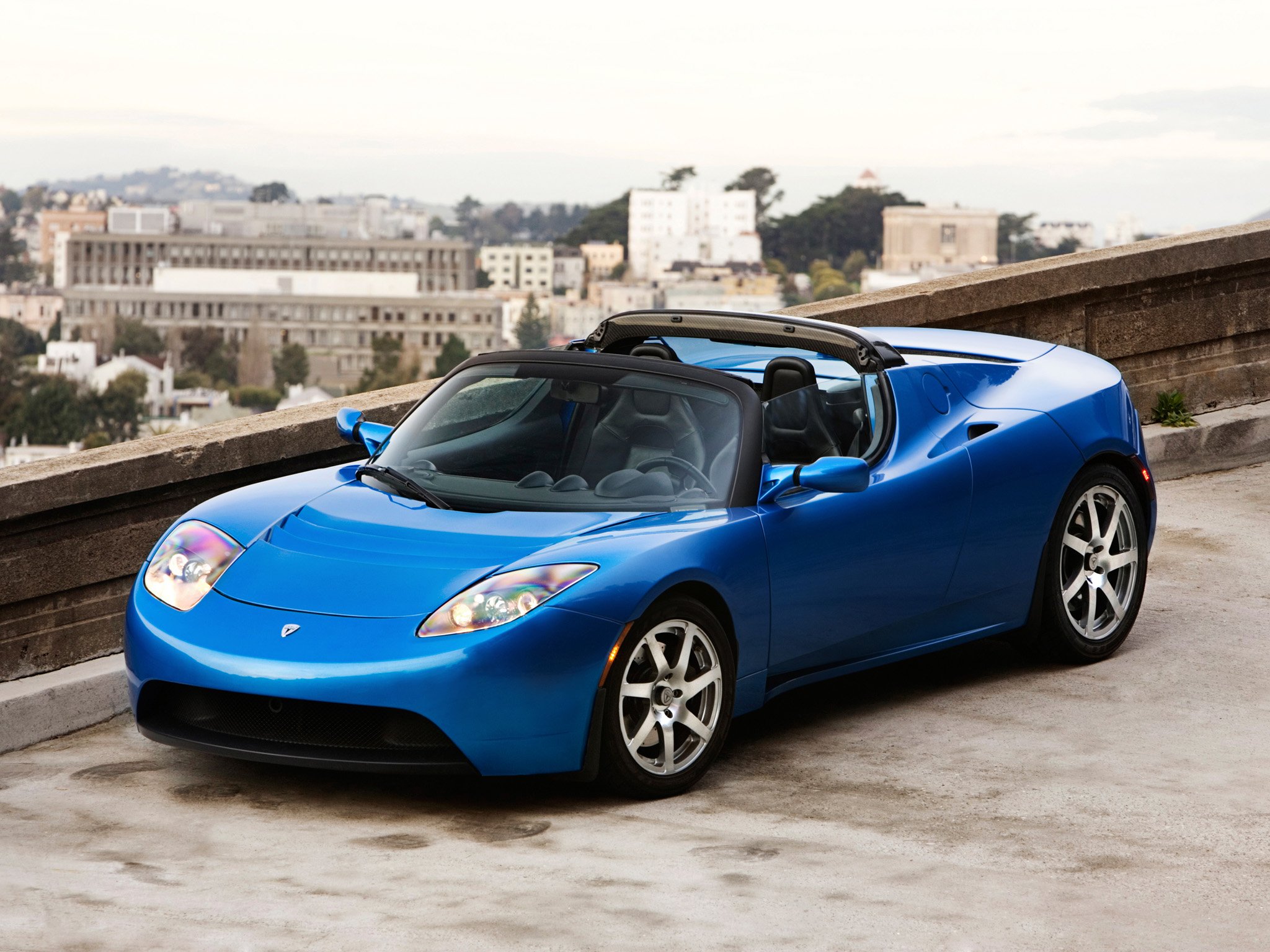 Автомобили года фото. Tesla Roadster 1. Тесла родстер кабриолет. Tesla Roadster 2006. Tesla Roadster 2009.